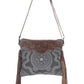 Monochromatic motif hand tooled bag