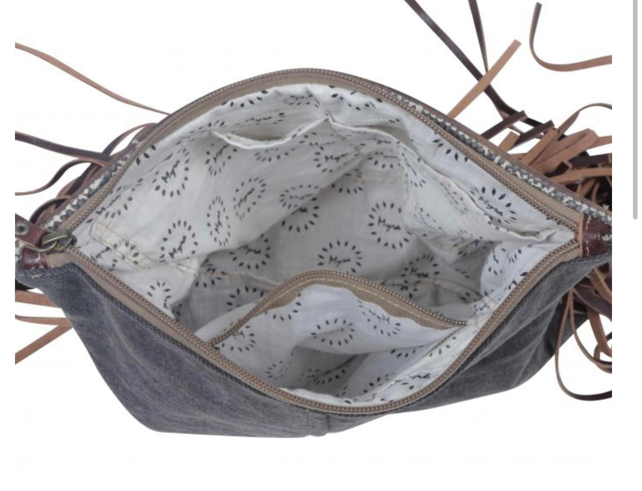 Monochromatic motif hand tooled bag