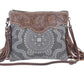 Monochromatic motif hand tooled bag