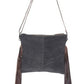 Monochromatic motif hand tooled bag